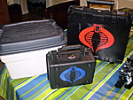 My wife's preference in displaying our collection. 
 
Blue Cobra stickered case: ROC figs 
Red Cobra stickered case: GI JOE 25th "The Good Guys"...
